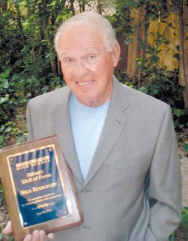 Renowned swim and dive coach honored