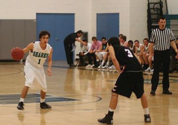 Boys Varsity basketball rebounds from close loss to first league win