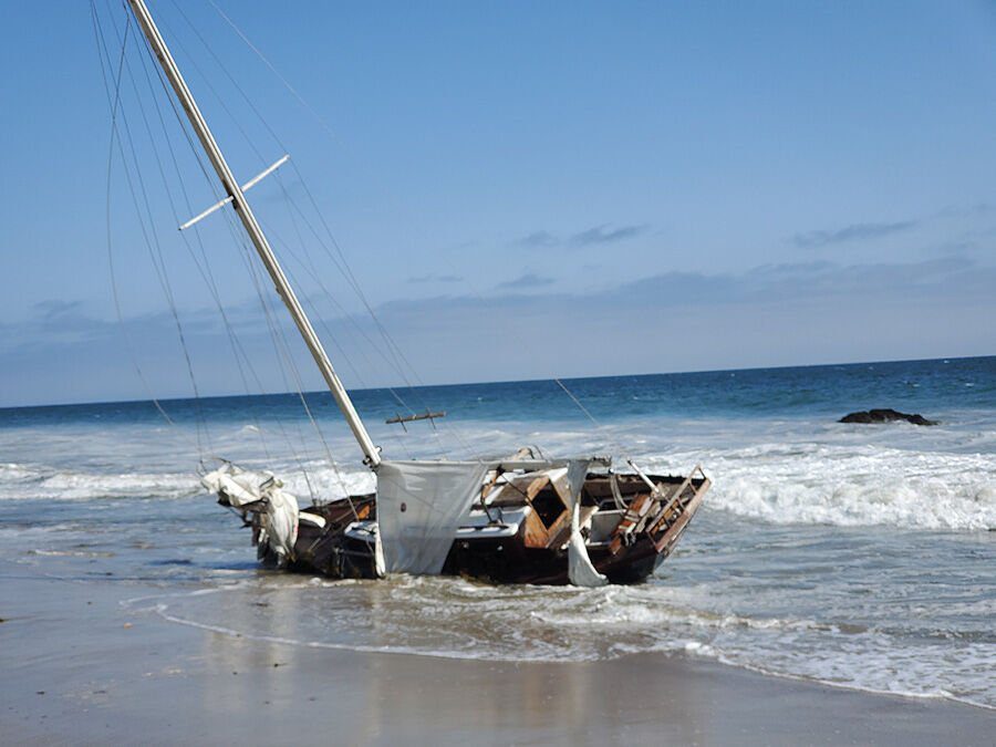 Large Empty Sailboat Crashes on the Colony Beach
