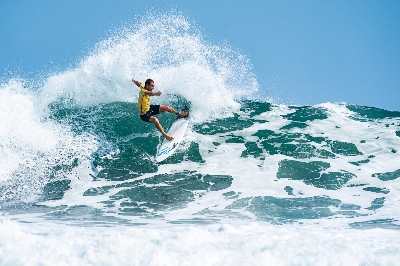 Malibu Surfer Catching Waves for Greece