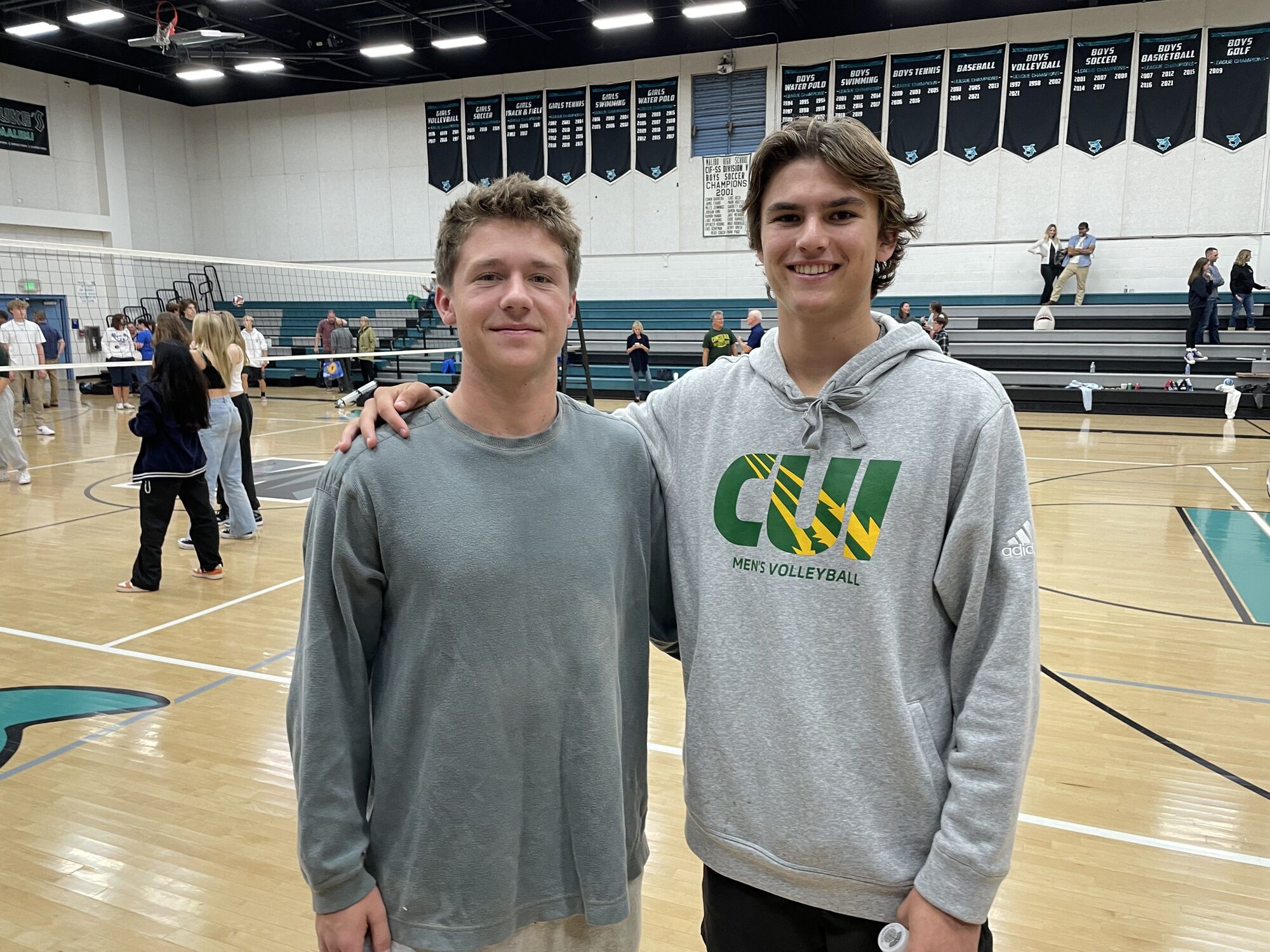 Kelly and Mulder, former Sharks volleyballers, see each other on college county