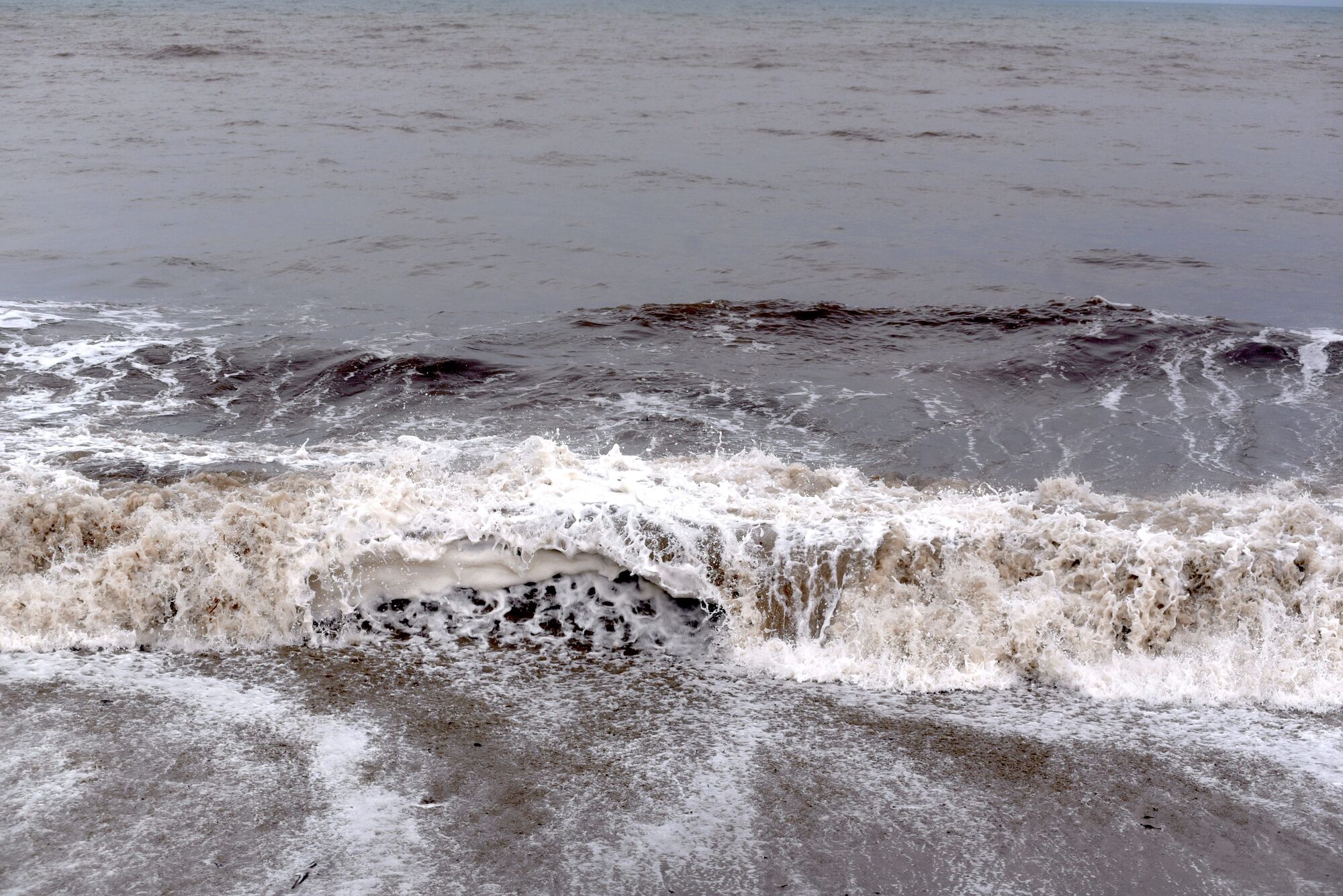 Rain, high tides and boulders continue to cause havoc