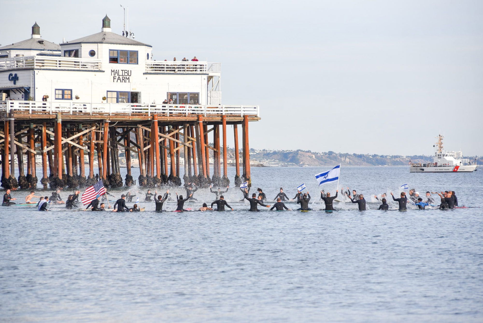 Siblings honor families in Israel with a paddle out at Surfrider Beach