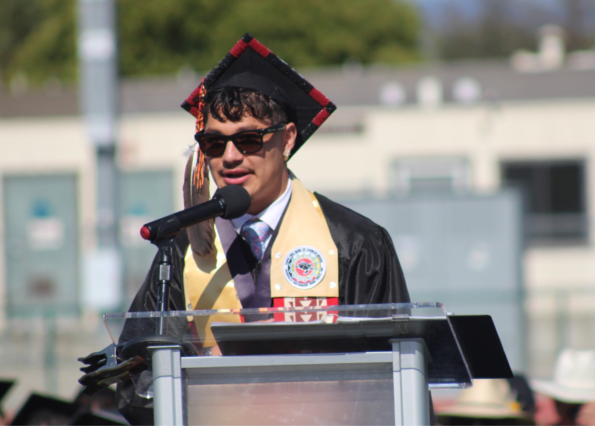 Santa Ynez High graduating senior Greyson Foy, the first of three student speakers, addresses the crowd during the 2026 graduation ceremony May 29 at Rio Memorial Field. Photo by Mike Chaldu/SYVS