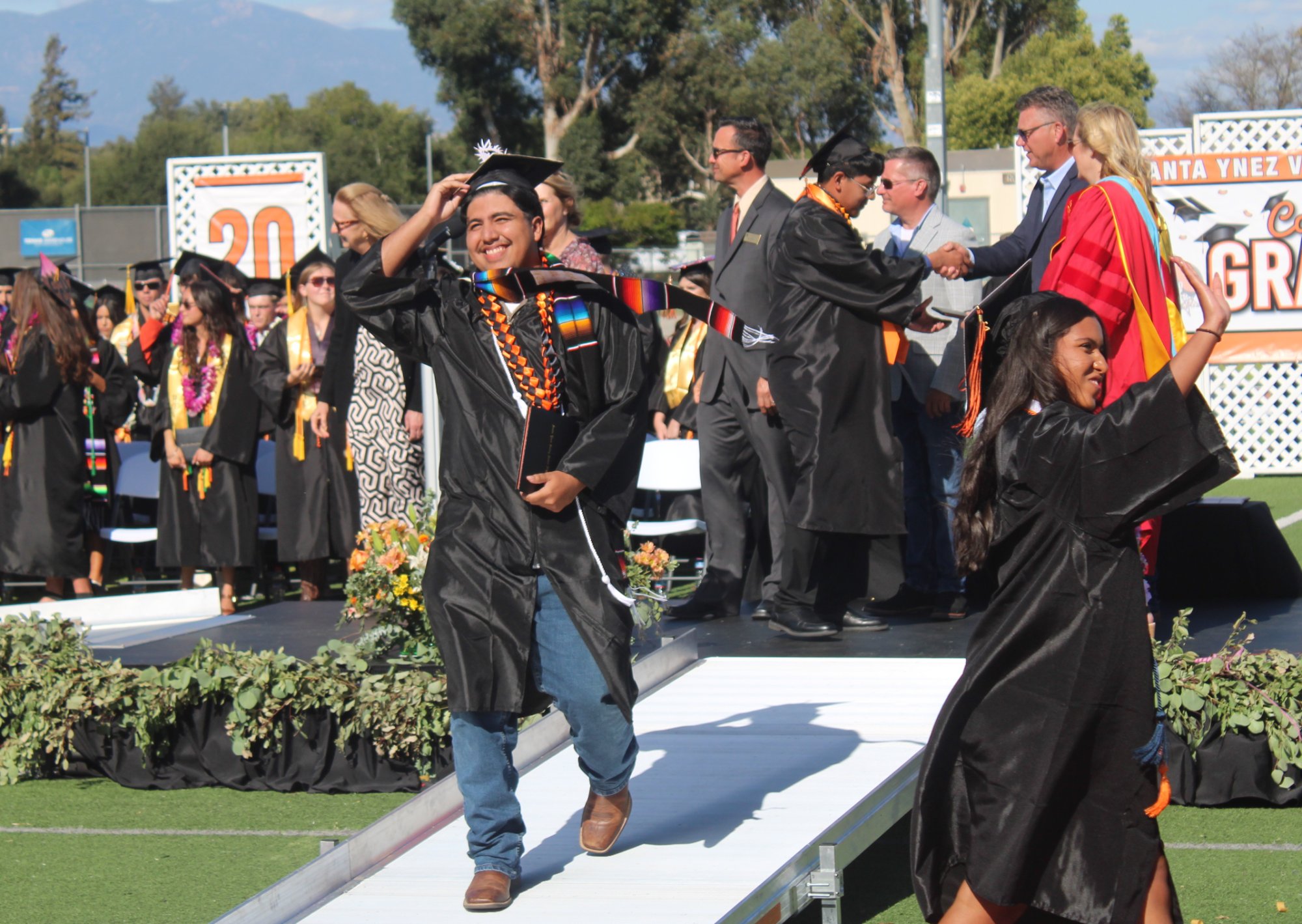 Students from Santa Ynez High’s Class of 2026 walk down the ramp toward the cheering audience members after receiving their diplomas during the May 29 graduation ceremony. Photo by Mike Chaldu/SYVS