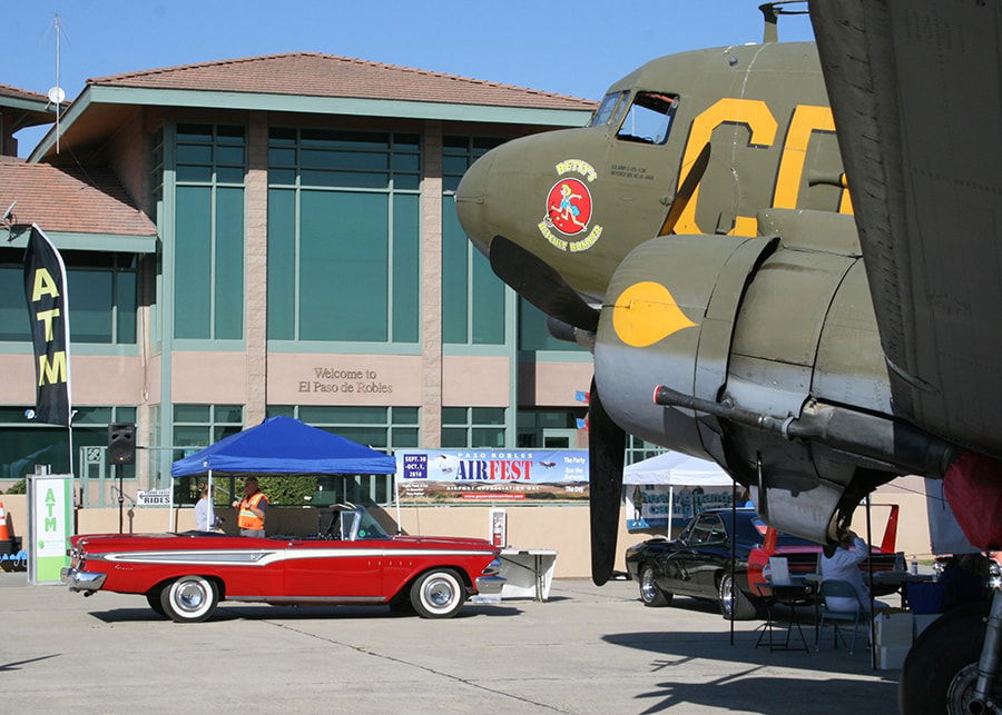 Cars and planes cruise the tarmac at Airfest.