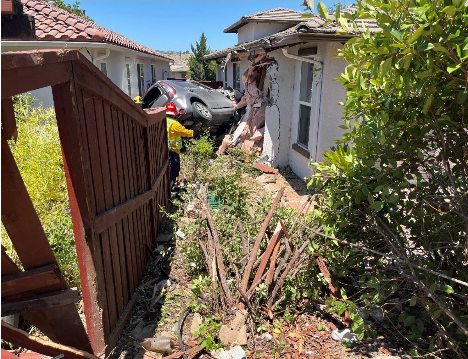 Traffic collision involving vehicle and residential structure