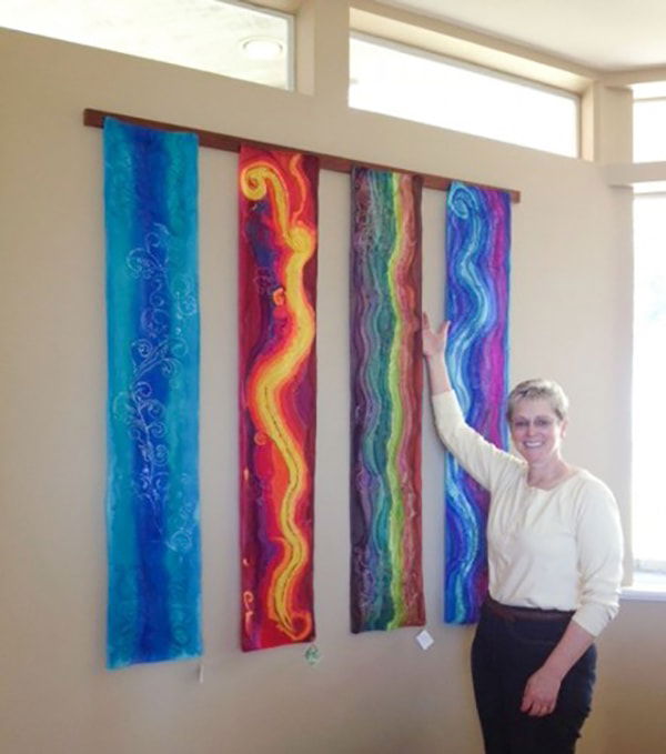 Art in the Park artist Deb Lysek with silk as her canvas.