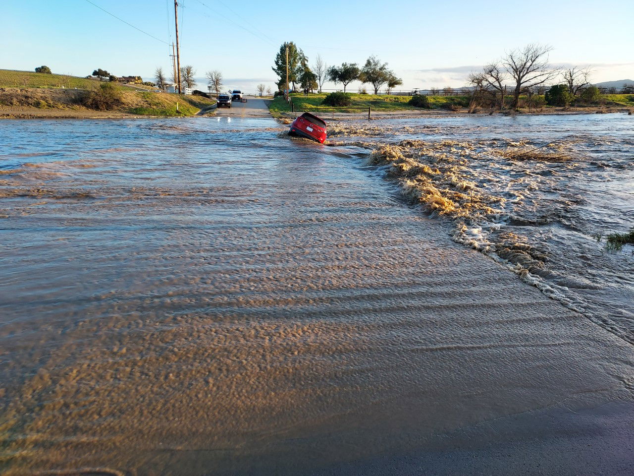 Mother and Her Three Children Rescued from Low Water Crossing in San Miguel