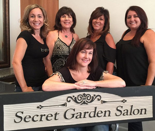 Lisa Maccagno, owner of The Secret Garden Salon, poses with hair stylists Christina Gordon, Liz McMahan and Brooke Montalvo and esthetician Laurie Wheeler.