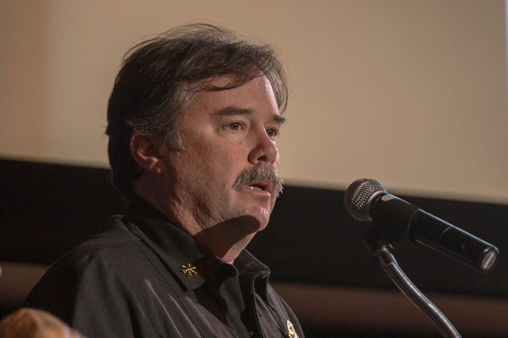 Emotional gathering focuses on acts of heroism