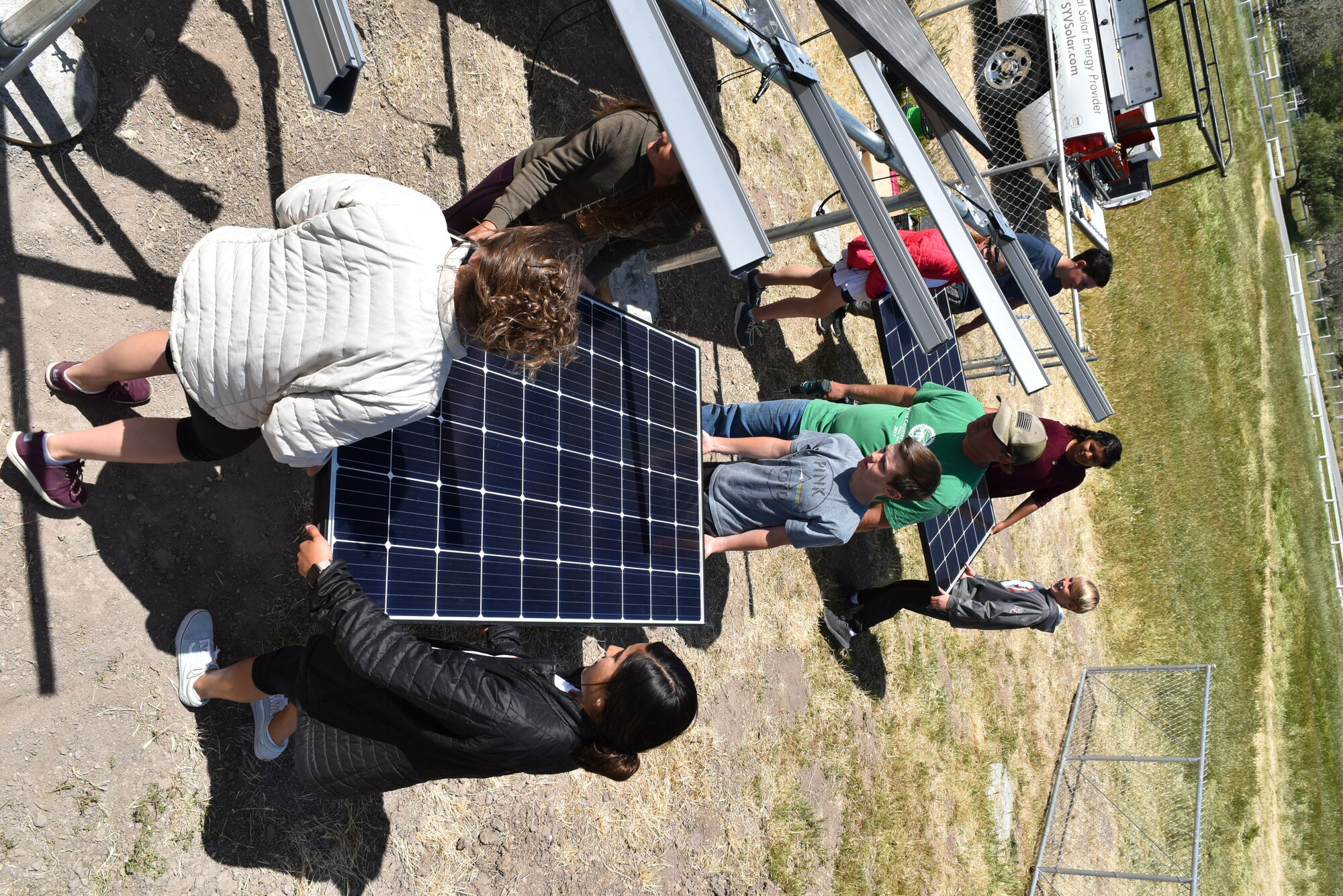 Dunn Middle Schoolers help install solar panels