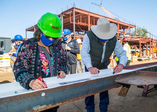 Hancock marks progress on Fine Arts Complex with beam signing ceremony