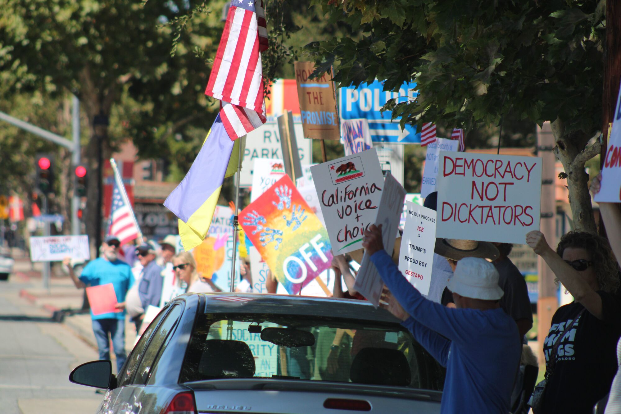 Demonstrators in Solvang gather to ‘Protect Our Checks’